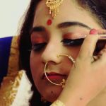 Makeup Artist Assisting The Beautiful Indian Bride.