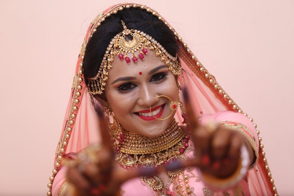 A Beautiful Indian Bride In A Wedding Photoshot With Full Makeup.