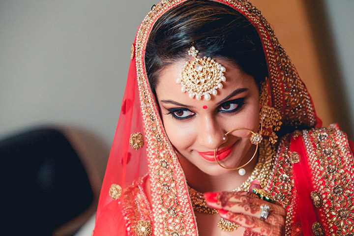 Portrait of a Beautiful Elegant Female Indian Model in Traditional Ethnic Asian Bridal Costume with Makeup.